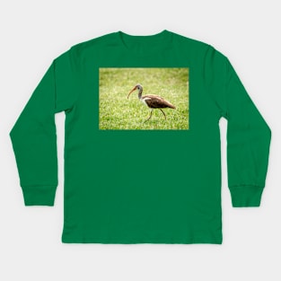 Young White Ibis Feeding in the Grass Kids Long Sleeve T-Shirt